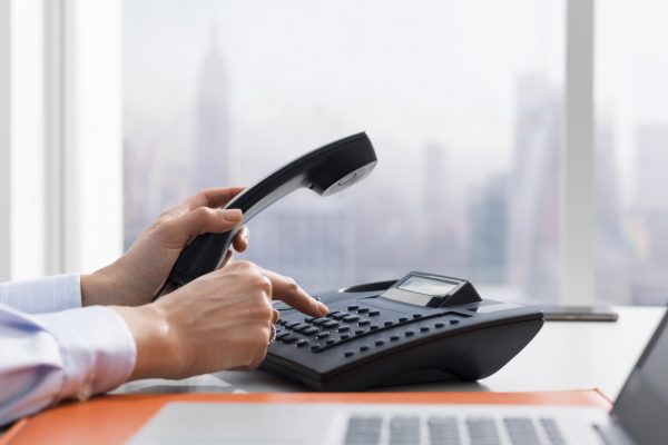 Female office worker making a phone call